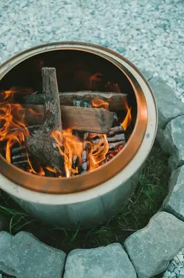 a fire in a pot on the ground at The A-Frame on Pudding Hill in Stamford