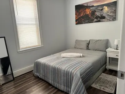 a bedroom with a bed with a pillow on it at Lovely 2Bed in Newark in Newark