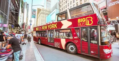 a red double decker bus on a city street at 3 Bedrooms Huge Apt in LIC, very next to Manhattan in Roosevelt Island