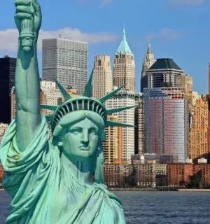 a statue of the statue of liberty in front of a city at 3 Bedrooms Huge Apt in LIC, very next to Manhattan in Roosevelt Island