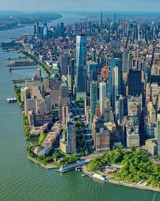 an aerial view of a large city on the water at 3 Bedrooms Huge Apt in LIC, very next to Manhattan in Roosevelt Island