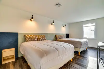 a bedroom with two beds and a window at Pet-Friendly Group Getaway 12 Mi to Camelback Mtn! in Cresco