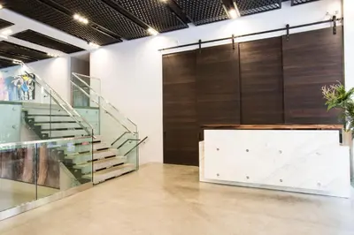 a lobby with a staircase and a wall of glass at Central Chelsea 1BR w Gym Doorman NYC-20 in New York