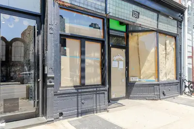 a store front with glass windows on a street at Blueground Greenpoint view nr Transmitter Park NYC-1896 in Brooklyn