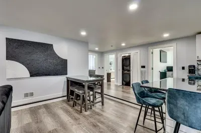 a kitchen and dining room with a table and chairs at 4 Mi to MetLife Stadium Modern Retreat! in Wallington