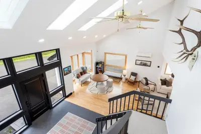 an open living room with a vaulted ceiling at 5 Minutes to Ski Hunter Mountain! Family Friendly - Hot Tub, Sauna, Sunset Views in Hunter