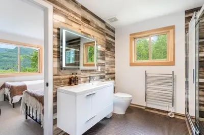 a bathroom with a sink and a toilet and a shower at 5 Minutes to Ski Hunter Mountain! Family Friendly - Hot Tub, Sauna, Sunset Views in Hunter