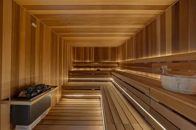 a sauna with wooden floors and a wooden ceiling at Family Staycation Retreat 7BDR Sauna Games