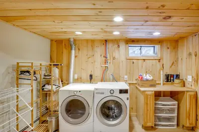 a laundry room with a washer and dryer at 5 Mi to Mt Snow Secluded Family Home with Game Area in West Dover