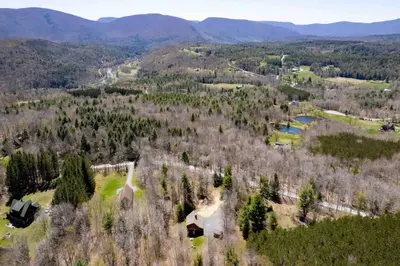an aerial view of an estate in the mountains at Cozy Log Cabin with Hot Tub 10 Min to Hunter Mtn in Jewett