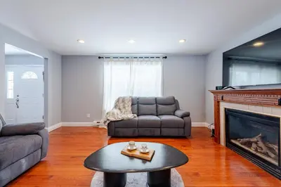 a living room with a couch and a fireplace at Lakeview Family Retreat Newly Renovated 4BR House in Pocono Country Place
