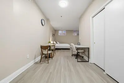 a room with a bed and a table and chairs at Chic Studio Retreat in New Haven in New Haven