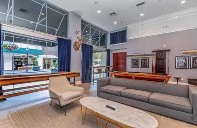 a living room with a pool table and a couch at Chic Studio Retreat in New Haven in New Haven
