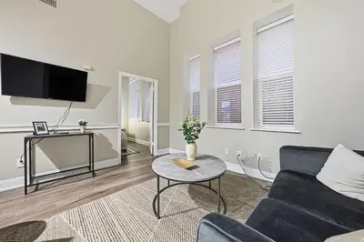 a living room with a couch and a table at Modern 1BR perfect for extended visits in New Haven