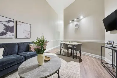 a living room with a couch and a table at Modern 1BR perfect for extended visits in New Haven