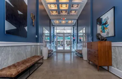 a lobby with a bench and blue walls at Modern 1BR perfect for extended visits in New Haven