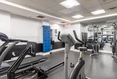 a gym with treadmills and a treadmill at Homey studio perfect for long-term guests in New Haven