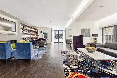 a living room with a couch and chairs and a table at FiDi Studio w Work Setup by Anyplace - 10250 in New York