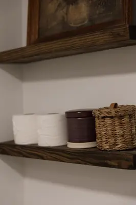 a shelf with towels and a basket on it at Secluded escape with hot tub, pizza oven, fireplace in Taghkanic