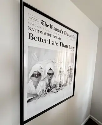 a framed picture of a picture of three women on a wall at 30 min from NYC luxury and chic 3 bedroom in Harrison