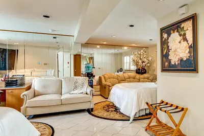 a bedroom with a bed and a living room at Spacious Yard with Gazebo Charming Windsor Retreat in Windsor