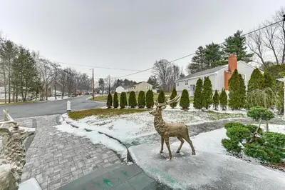 a statue of a deer standing in a driveway at Spacious Yard with Gazebo Charming Windsor Retreat in Windsor