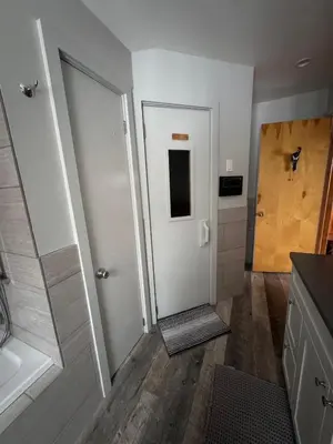 a bathroom with a shower and a walk in shower backdoor at Serene 4-bedroom chalet in charming Catskills awaits you- amazing Mountain Views in Bovina Center