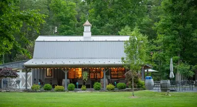 a building with a tower on top of it at Historic Winery Farmhouse by Lake in Hawley