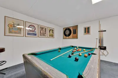 a room with a pool table with balls on it at Charming Getaway Minutes from Lake Wallenpaupack in Tafton