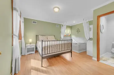a baby bedroom with a crib and a bath tub at Large Family Friendly House on the Fairway Hideout in Lakeville