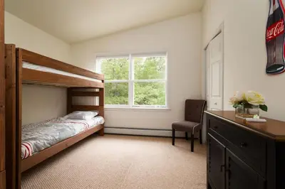a bedroom with a bunk bed and a window at The Lookout Lake Masthope Firepit Arcade in Lackawaxen