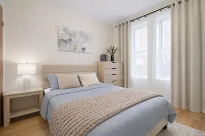 a white bedroom with a bed and a window at Bright 3BD Unit Close to Columbia University & Central Park in New York