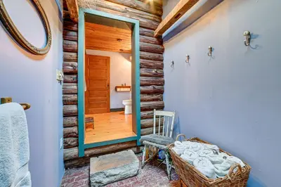 a room with a mirror and a wooden wall at Family Cabin Near Bellayre and Plattekill Mtns! in Andes
