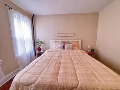 a large bed in a room with a window at Perfect full private first floor home with convenient amenities in Union