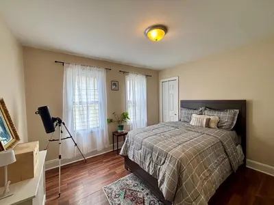 a bedroom with a bed and a camera in it at Perfect full private first floor home with convenient amenities in Union