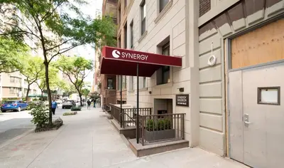 a sign for a synagogue on the side of a building at Synergy Madison in New York