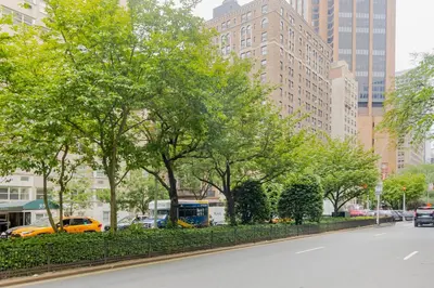 a street in a city with trees and buildings at Midtown 1BR w Gym Doorman nr Grand Central NYC-746 in New York