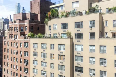 an apartment building with plants on the roofs at Blueground Murray Hill view nr Empire State NYC-1911 in New York