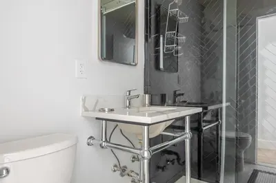 a bathroom with a sink and a shower and a toilet at Blueground Murray Hill view nr Empire State NYC-1911 in New York