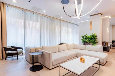 a living room with a couch and a table at Blueground Downtown Brooklyn rooftop nr Brooklyn Bridge NYC-2186 in Brooklyn