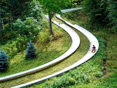 a person riding a toy train on a winding road at Mountain Getaway Suite Ski OnOff Jiminy Peak - Fully Redone Decor in Hancock