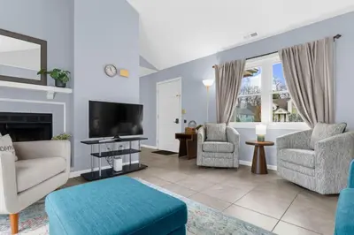 a living room with a couch and a tv at Willow Haven 2BR Cozy Retreat, Close to Hartford in Manchester