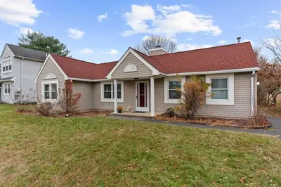 a white house with a red roof at Willow Haven 2BR Cozy Retreat, Close to Hartford in Manchester