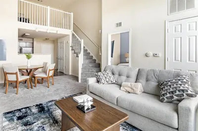 a living room with a couch and a table at Landing Stunning 2BD Gym in New Haven