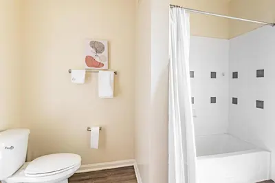 a bathroom with a toilet and a shower at Landing Stunning 2BD Gym in New Haven