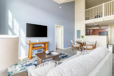 a living room with a couch and a table at Landing Stunning 2BD Gym in New Haven