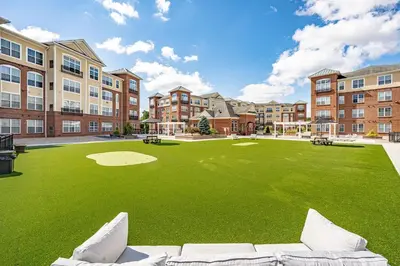 a large artificial lawn in front of a building at Landing Stunning 2BD Gym in New Haven