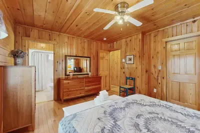 a bedroom with a bed and a ceiling fan at Chimney Hill Retreat in Wilmington