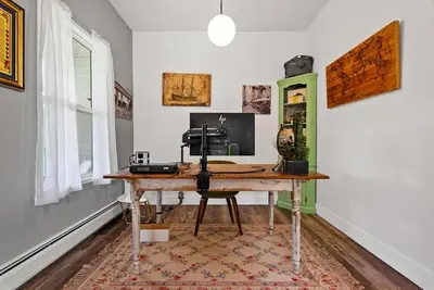 a room with a desk with a computer on it at Country Chic 3BR Retreat Near All Star Village in Treadwell