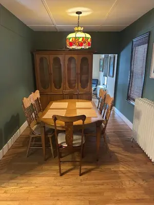 a dining room with a wooden table and chairs at Charming Four Bedroom House in Tannersville